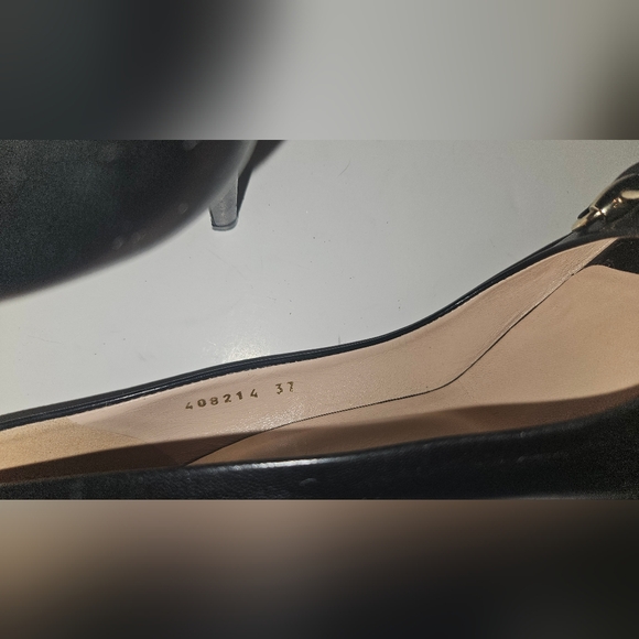 Gucci Black Flats with Gold Detailing